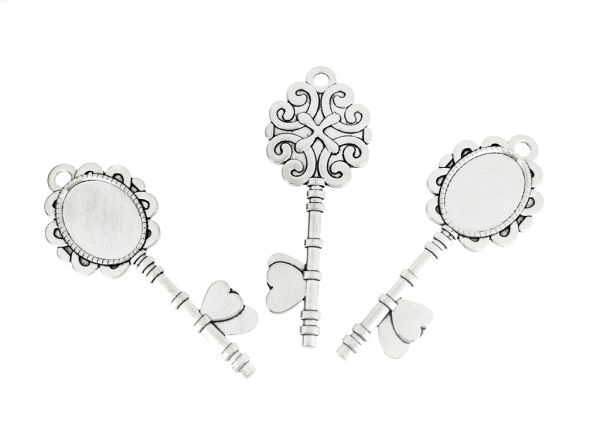 МЕТАЛНИ ЕЛЕМЕНТИ - ОСНОВА ЗА КАБОШОН - ЕЛИПСА 18х25мм - КЛЮЧ - НИКЕЛ - 2 бр. Отвор-5.0мм